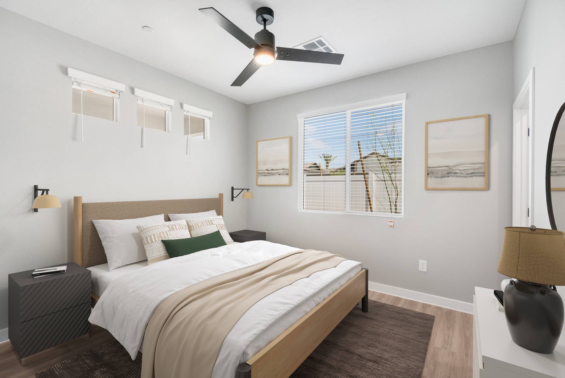 Sonita Apartments in Goodyear, AZ Modern bedroom with a double bed, nightstands, ceiling fan, and large window with blinds.